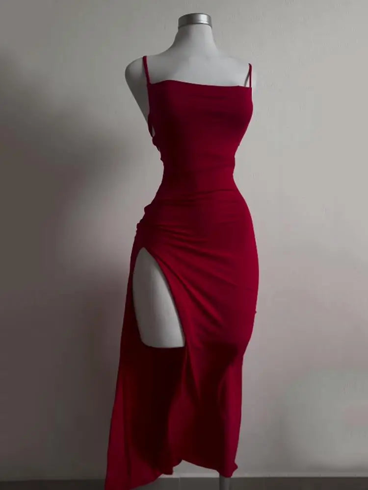 Open back, halter strap Spice Girl bag hip dress